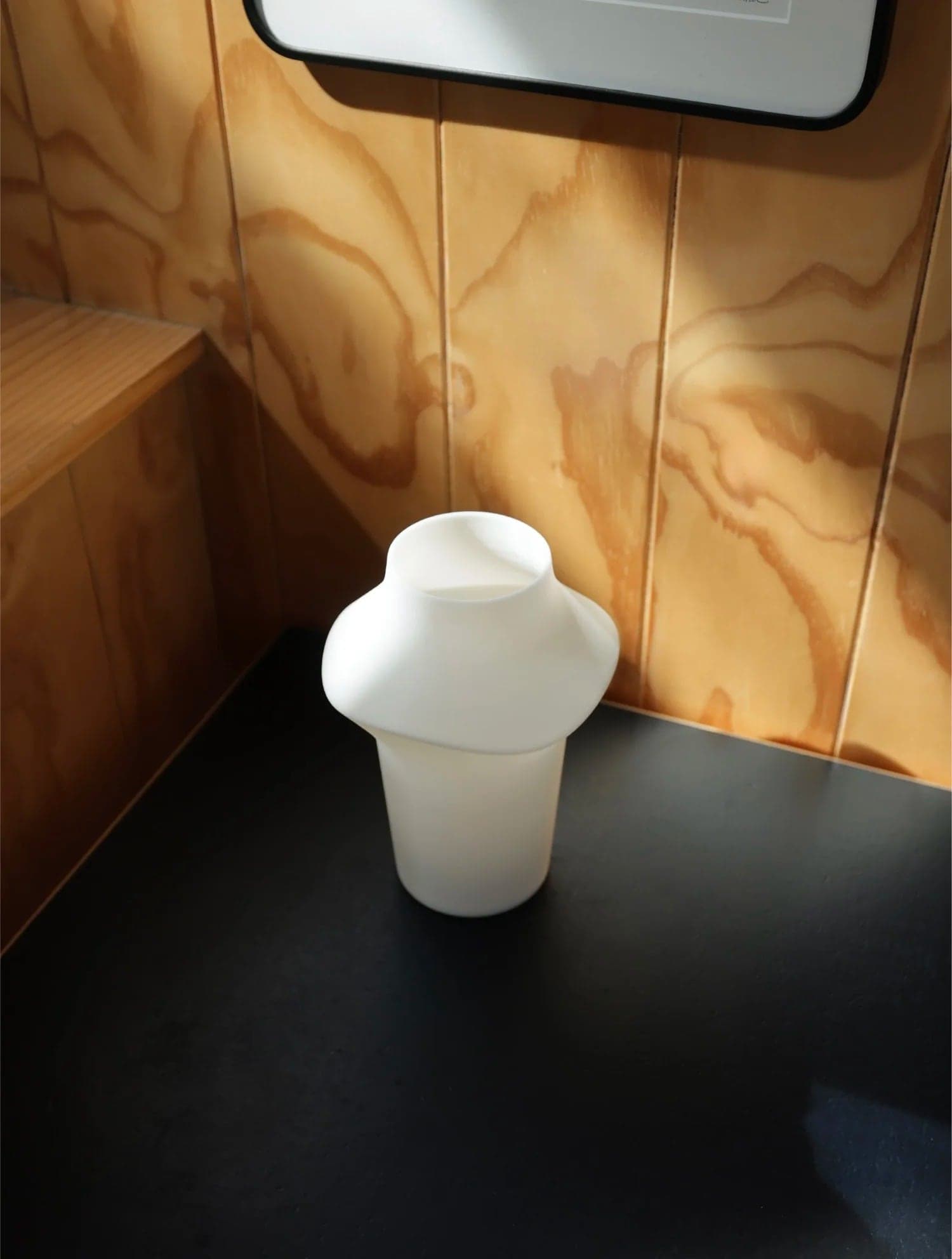 Fable lamp against plywood walls