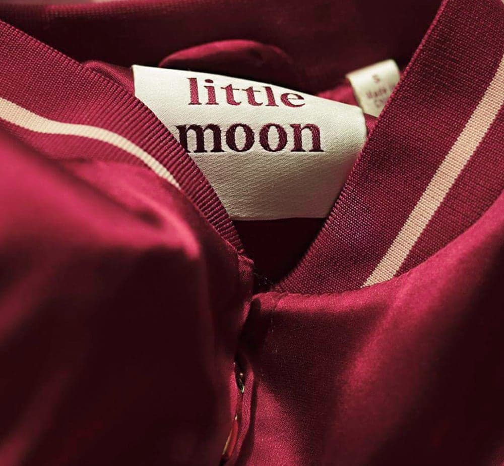 Little Moon label inside a burgundy satin jacket