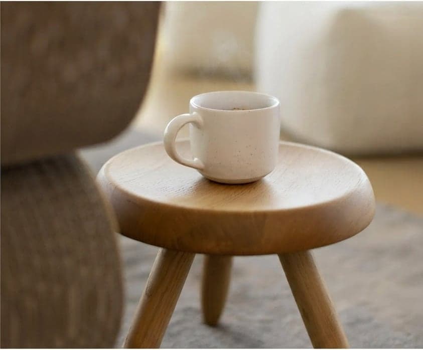 Cup on a small wooden stool