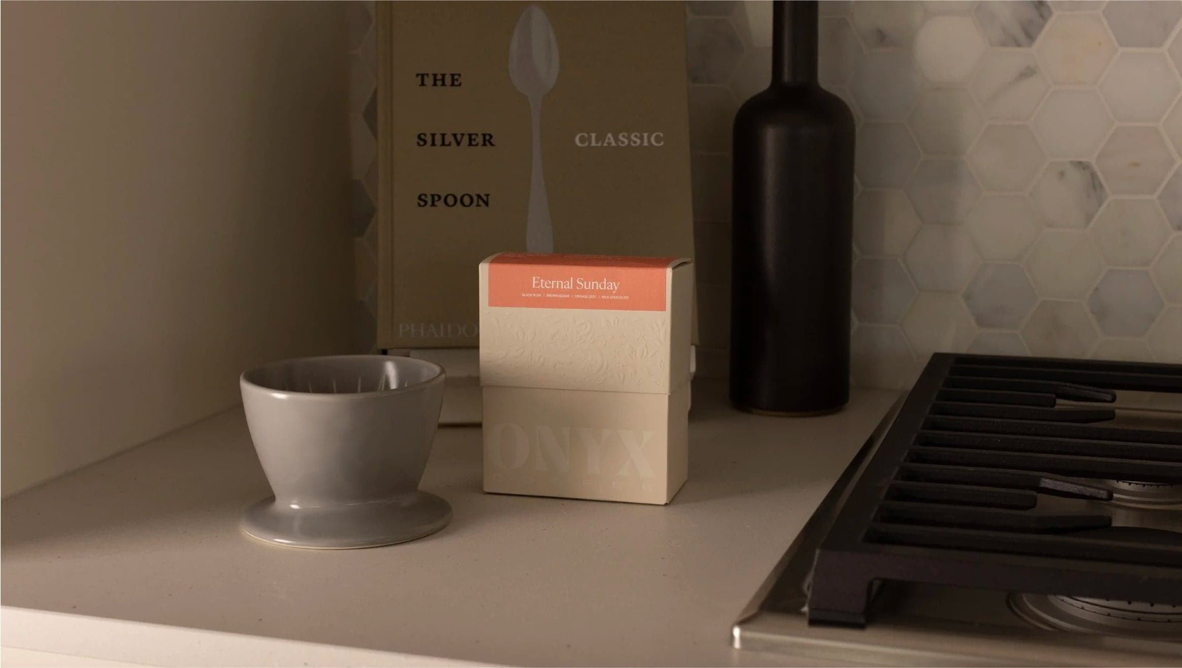 Tea box and cup on a kitchen counter