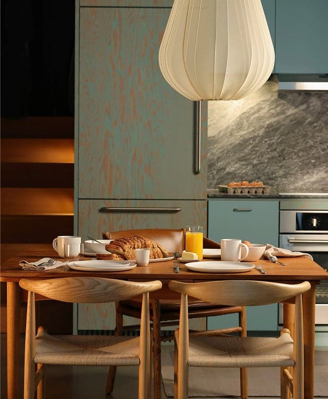 Dining table set beneath a paper pendant